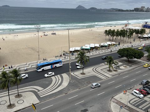 An overcast view down to a beachfront avenue and the sea