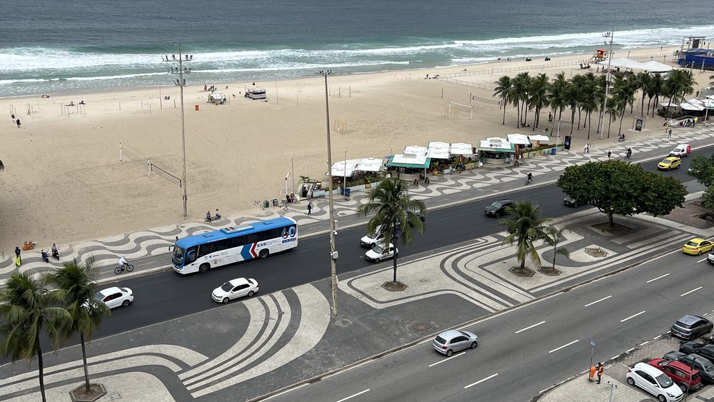 An overcast view down to a beachfront avenue and the sea