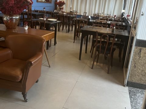 An empty restaurant dining room with the tables set