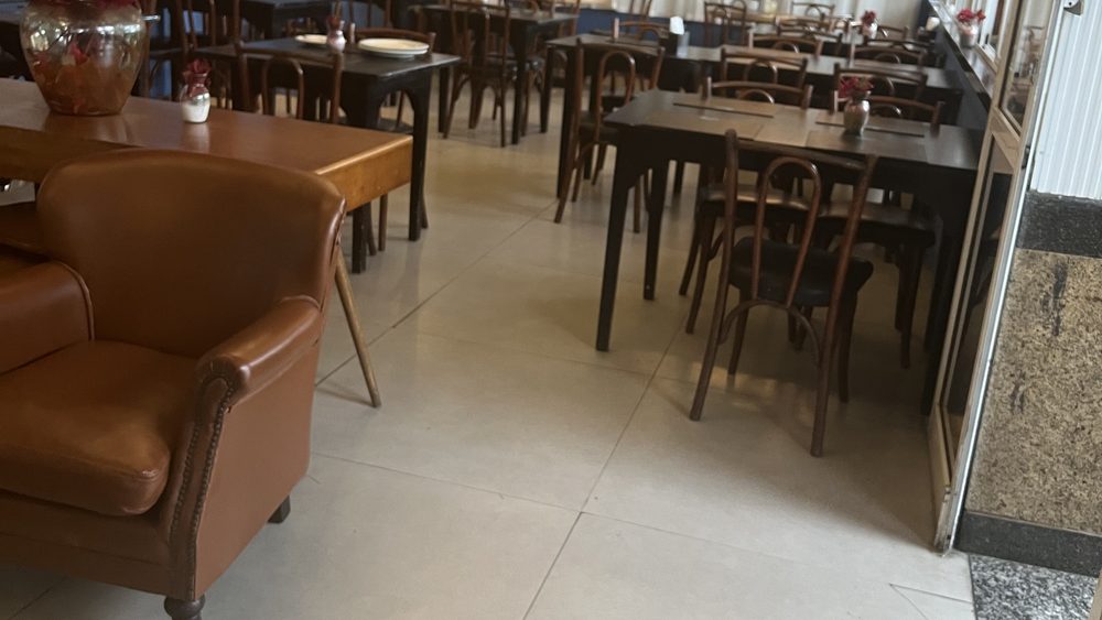 An empty restaurant dining room with the tables set