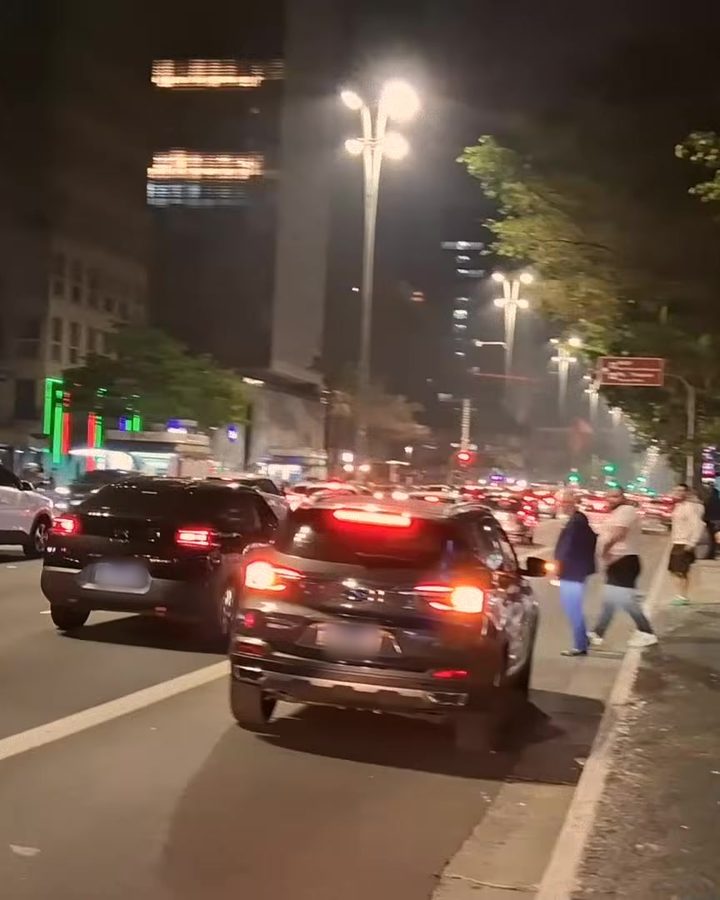 Night view of Avenida Paulista with traffic and street lights