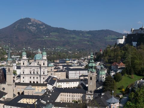 Panorama of Salzburg old town with the fortress and mountains behind