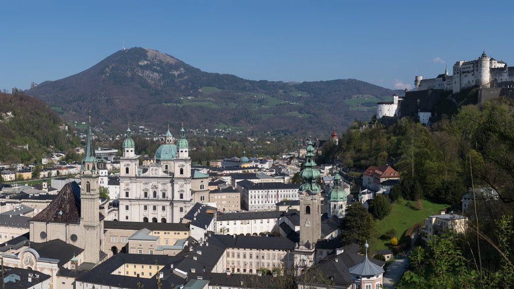 Panorama of Salzburg old town with the fortress and mountains behind
