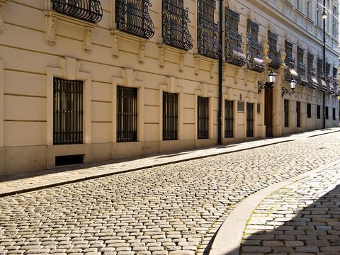 Cobbled Vienna street lined with classic Altbau buildings