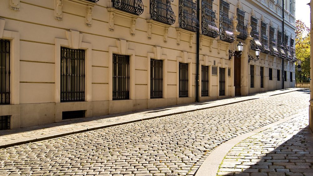 Cobbled Vienna street lined with classic Altbau buildings