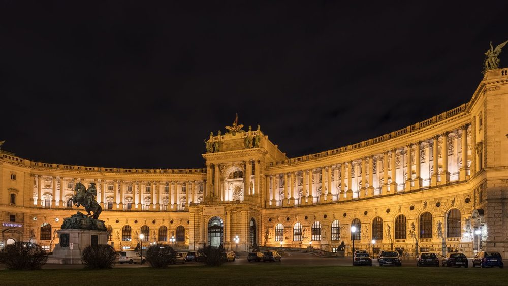 The Neue Burg wing of the Hofburg in Vienna, lit up at night on Heldenplatz