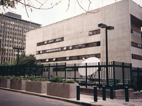 US Embassy chancery building in Bogota behind its fence