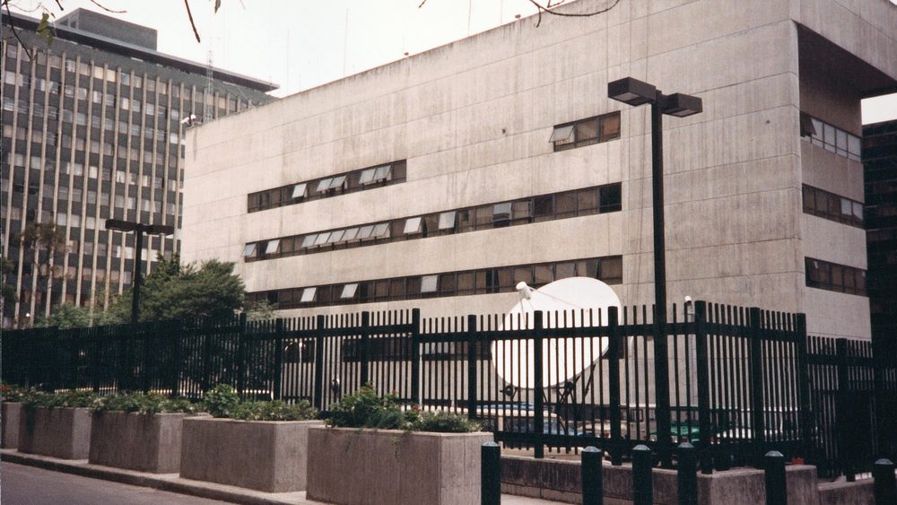 US Embassy chancery building in Bogota behind its fence