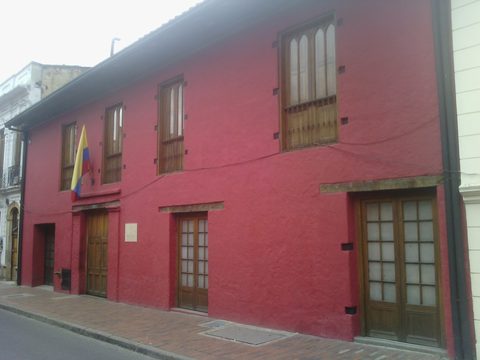 Red colonial facade of a government ministry building in Bogota's historic center