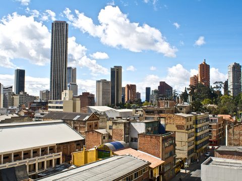 Downtown Bogota skyline of towers and low rooftops under blue sky