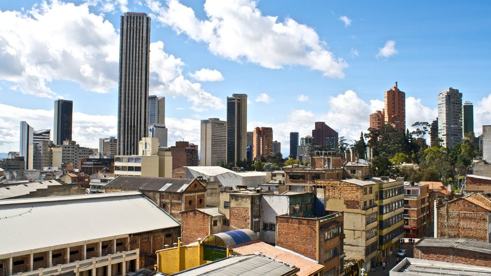 Downtown Bogota skyline of towers and low rooftops under blue sky