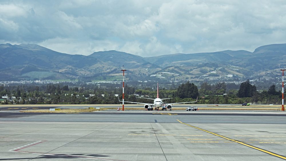Aircraft on the runway at Mariscal Sucre International Airport with the Andes behind, Quito, Ecuador