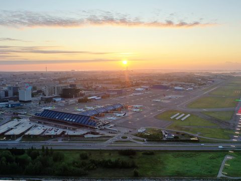 Passenger terminal and runway at Tallinn Airport at sunrise, Estonia