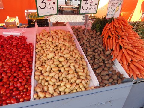 Tomatoes, potatoes and carrots for sale at Helsinki Market Square