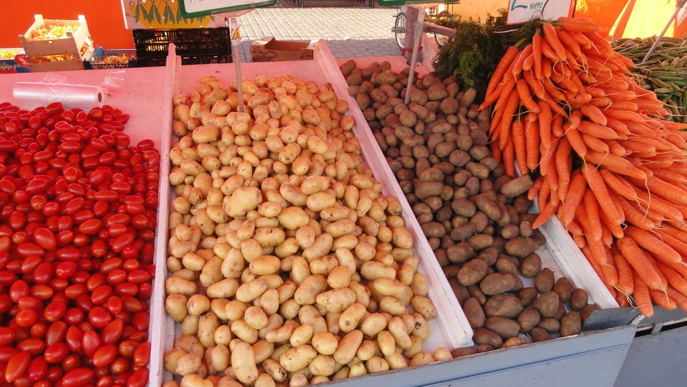 Tomatoes, potatoes and carrots for sale at Helsinki Market Square