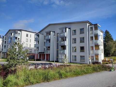 Modern white apartment buildings on Nuijatie with a garden in front