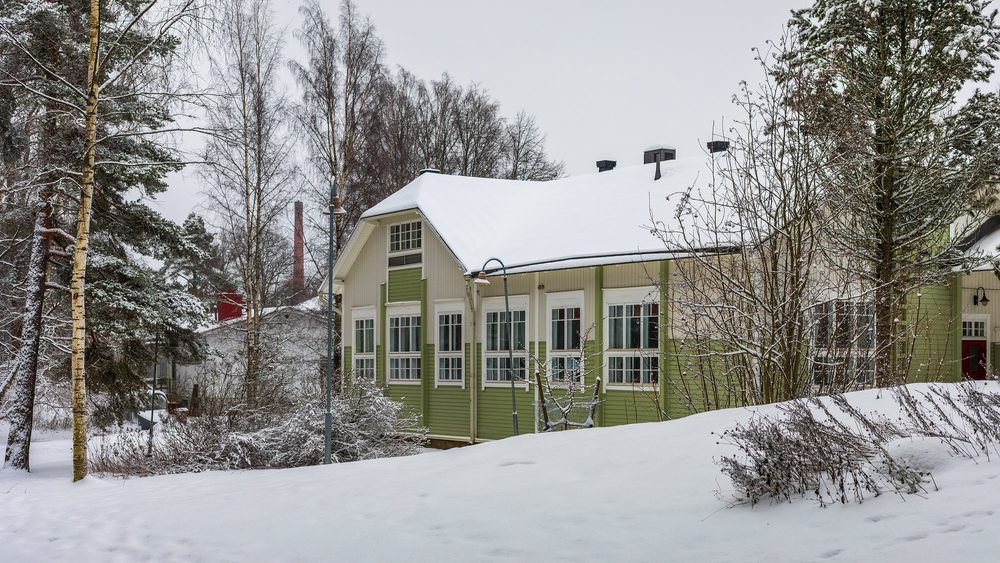 Wooden Ollerinkatu school in Riihimaki under snow