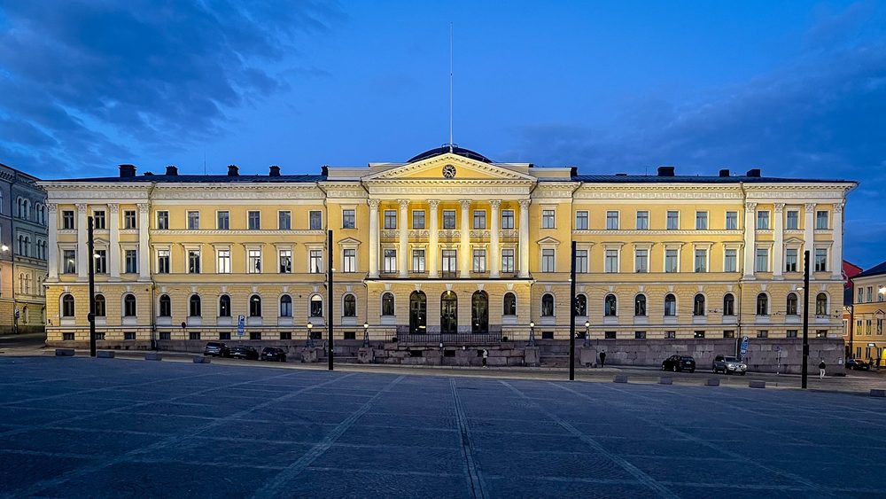 Yellow neoclassical state government office building in Helsinki at dusk