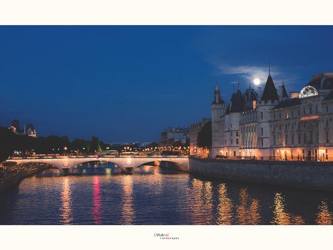The Seine and the Conciergerie in Paris at night