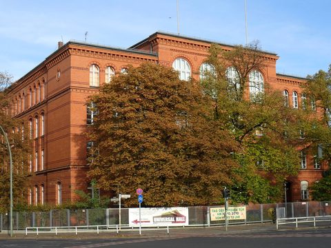 Red brick Gotzkowsky primary school in Berlin-Moabit framed by autumn trees