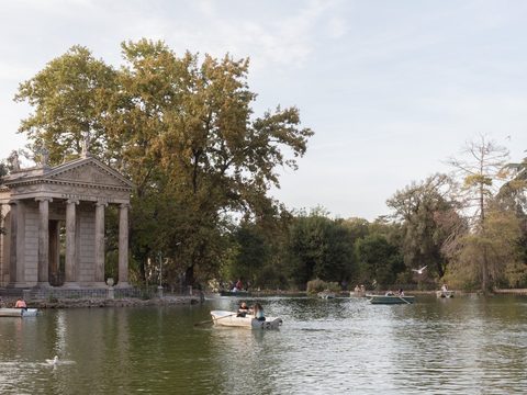 Temple of Aesculapius on the lake in Villa Borghese park, Rome, Italy