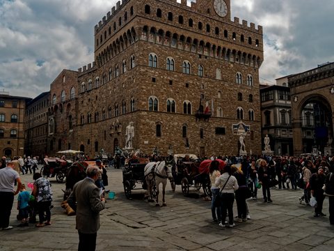 Families and visitors in Piazza della Signoria in Florence