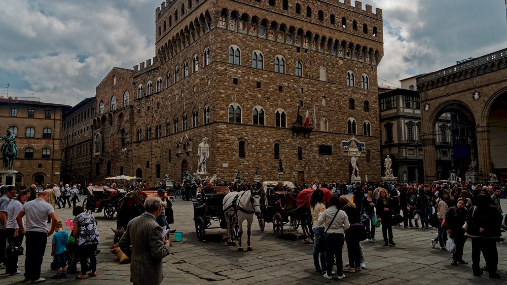 Families and visitors in Piazza della Signoria in Florence