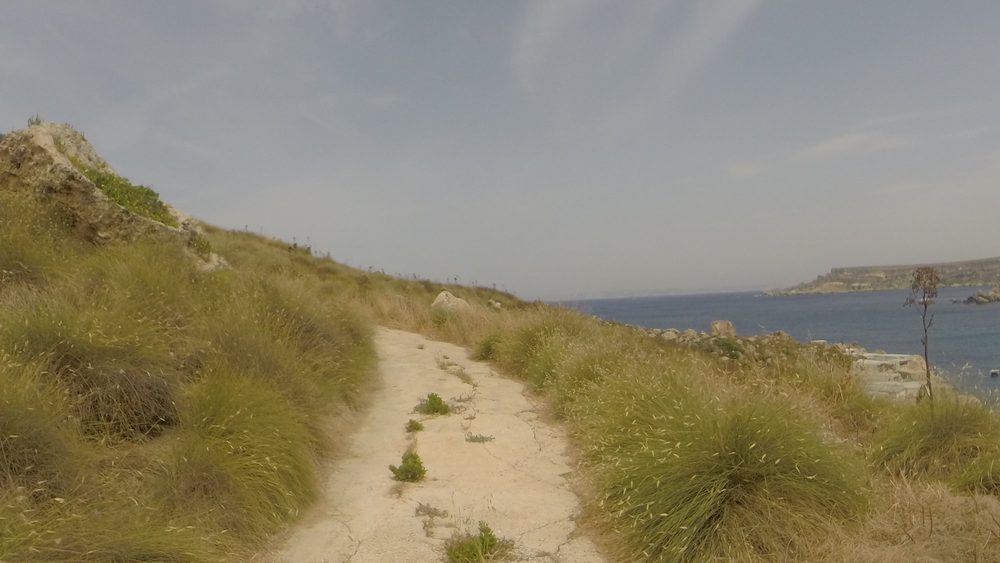 Narrow country road near the coast in Mgarr, Malta