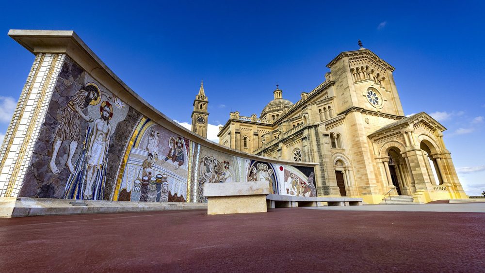 Ta' Pinu basilica in the Gozo countryside under a blue sky