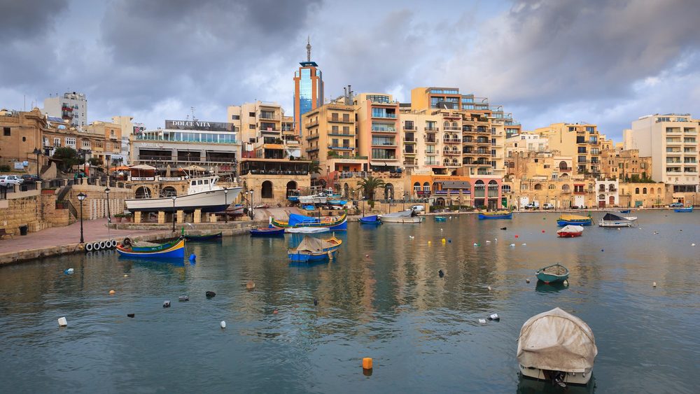Spinola Bay in St Julian's with fishing boats and waterfront buildings