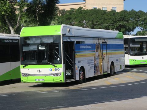 Green and white Malta Public Transport bus at a stop
