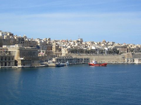 Panorama of Valletta and its harbour walls from across the water