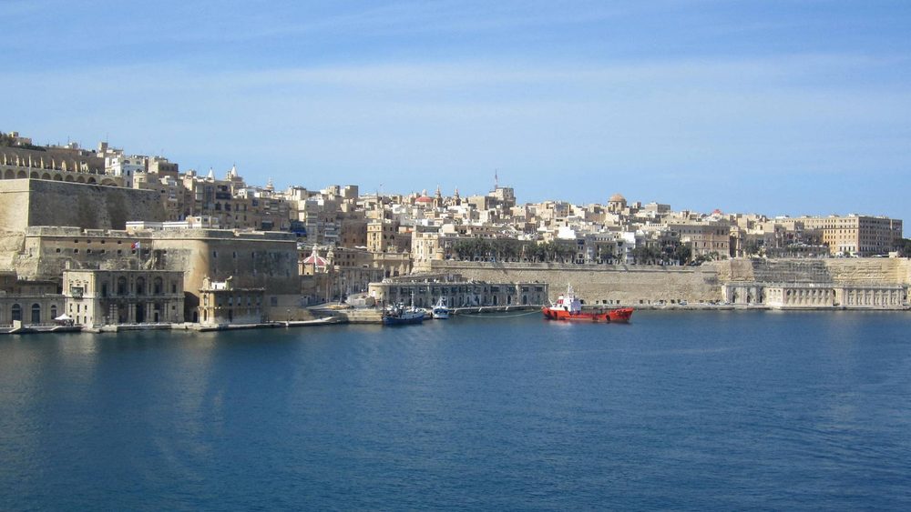 Panorama of Valletta and its harbour walls from across the water