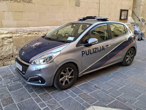 Malta police car parked on a Valletta street