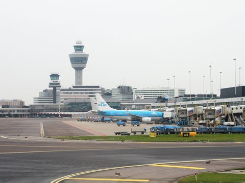 Amsterdam Schiphol Airport apron with KLM jets and the control tower