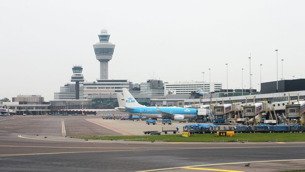 Amsterdam Schiphol Airport apron with KLM jets and the control tower