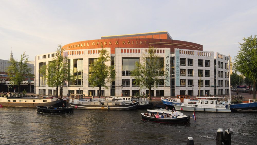 The Stopera, Amsterdam city hall and opera house, on the Amstel