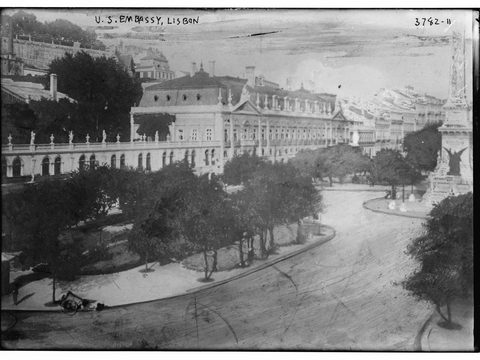 Historic black and white photograph of the US Embassy in Lisbon and its garden square