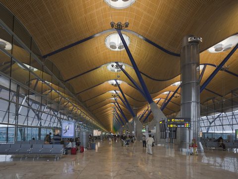 The wavy bamboo ceiling and yellow columns of Terminal 4 at Madrid-Barajas Airport