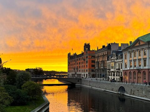 Government buildings along Norrstrom in Stockholm at sunset