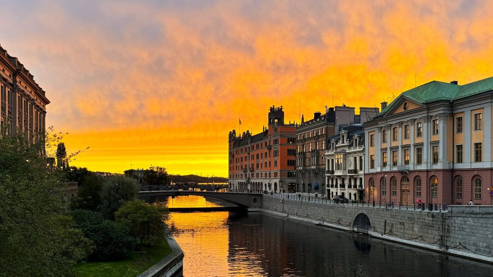 Government buildings along Norrstrom in Stockholm at sunset