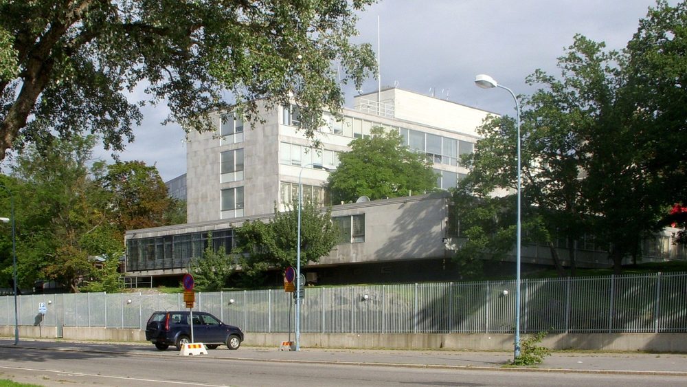 US Embassy building in Stockholm behind its security fence