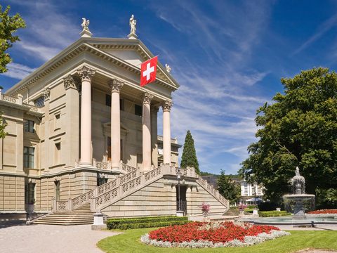 Winterthur Stadthaus with its columned facade and Swiss flag