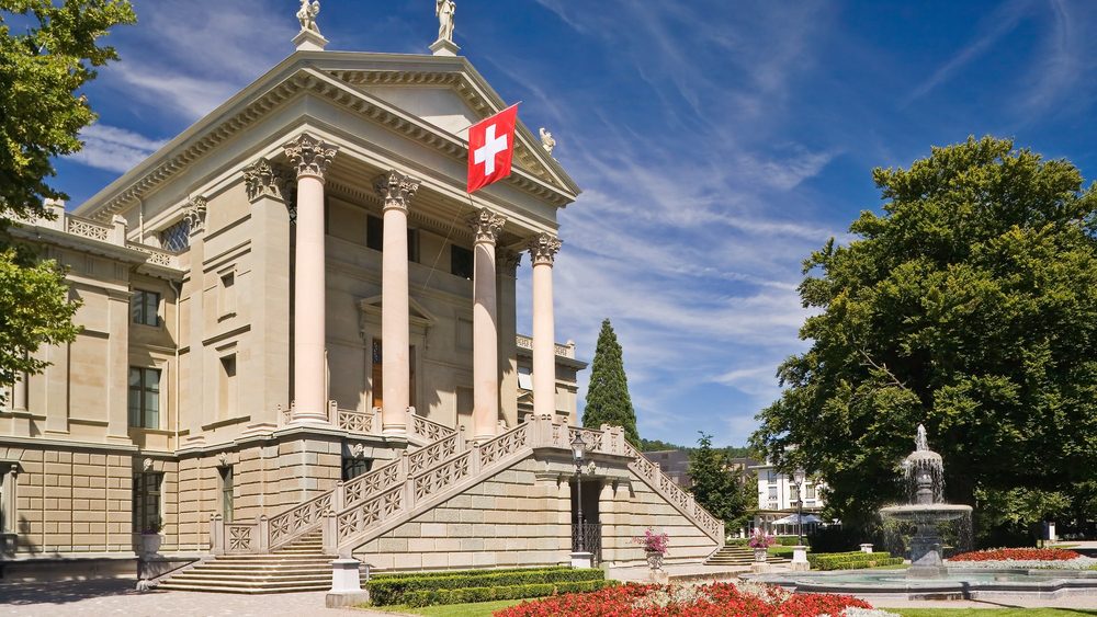 Winterthur Stadthaus with its columned facade and Swiss flag