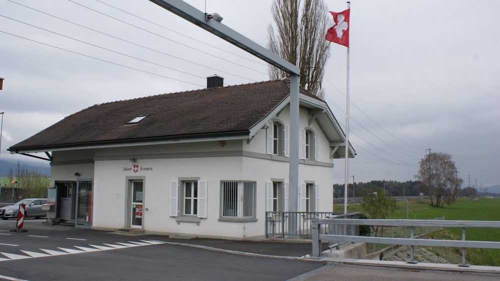 Swiss customs house at the Kriessern border crossing with the Swiss flag