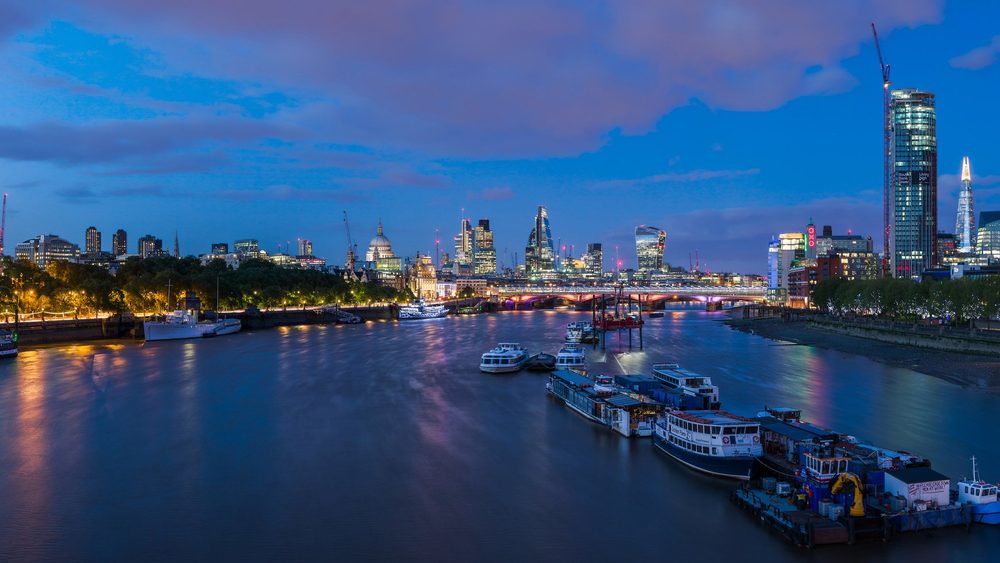 London skyline and the Thames seen from Waterloo Bridge at dusk, United Kingdom