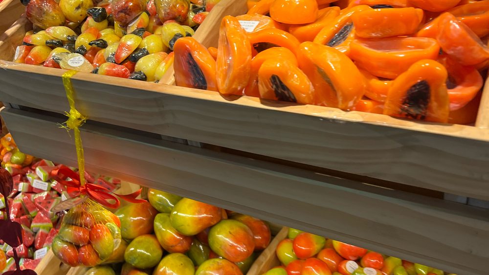 Handmade soaps shaped and coloured like tropical fruit on a market stall